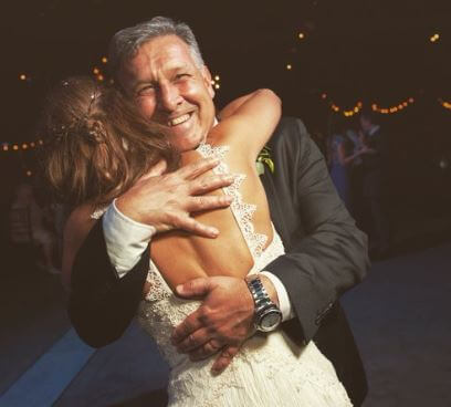 Maria Alejandra Martino husband Tata Martino embracing their daughter Noel Martino at her wedding in 2018.